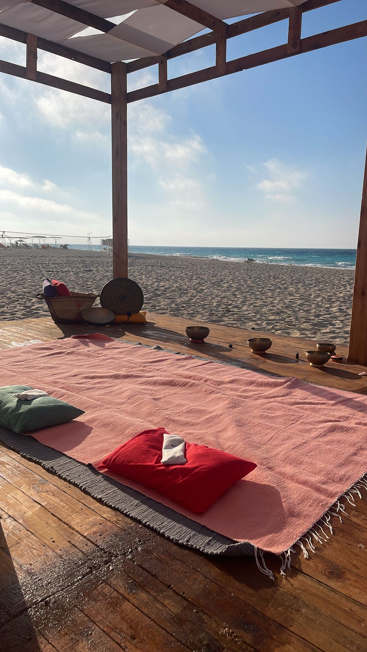 Intimate private session setup with singing bowls and cushions