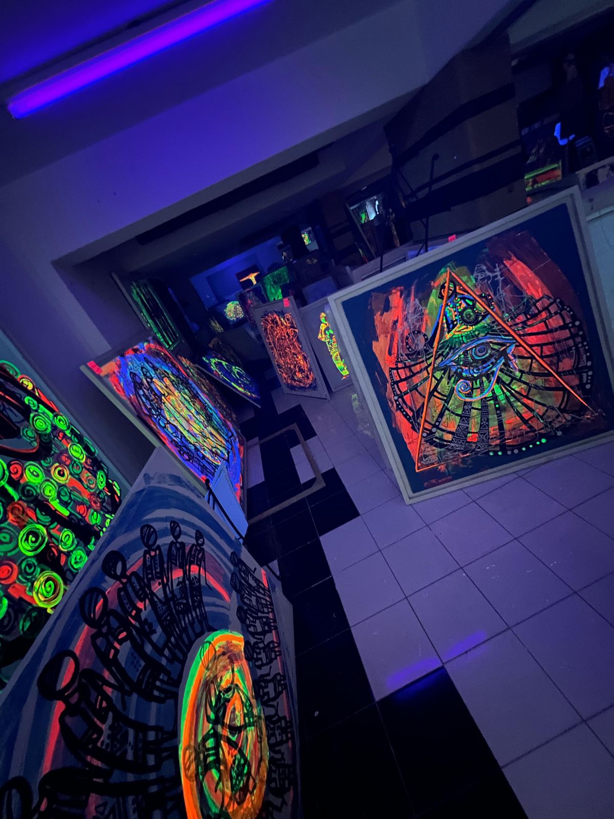 Pyramid and eye artwork displayed in the gallery